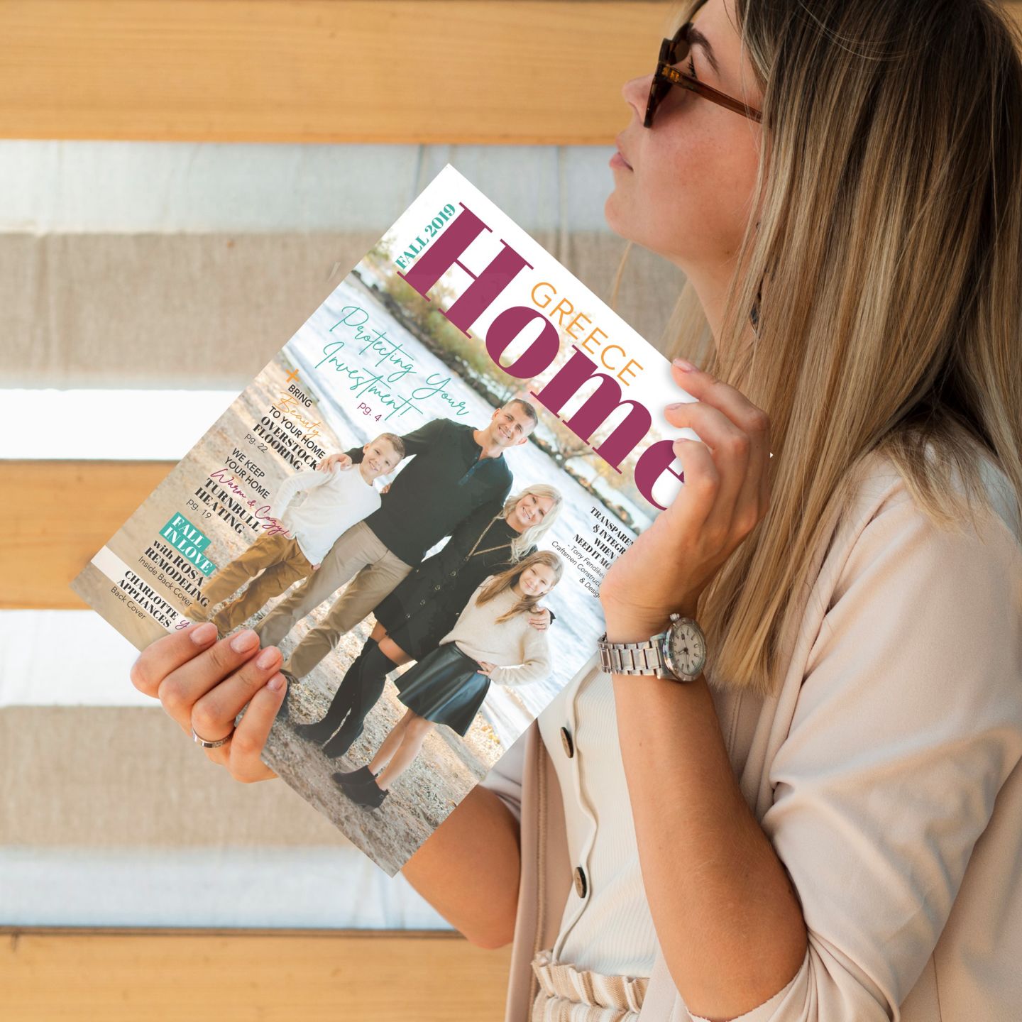 Person holding up the Greece Home Publication